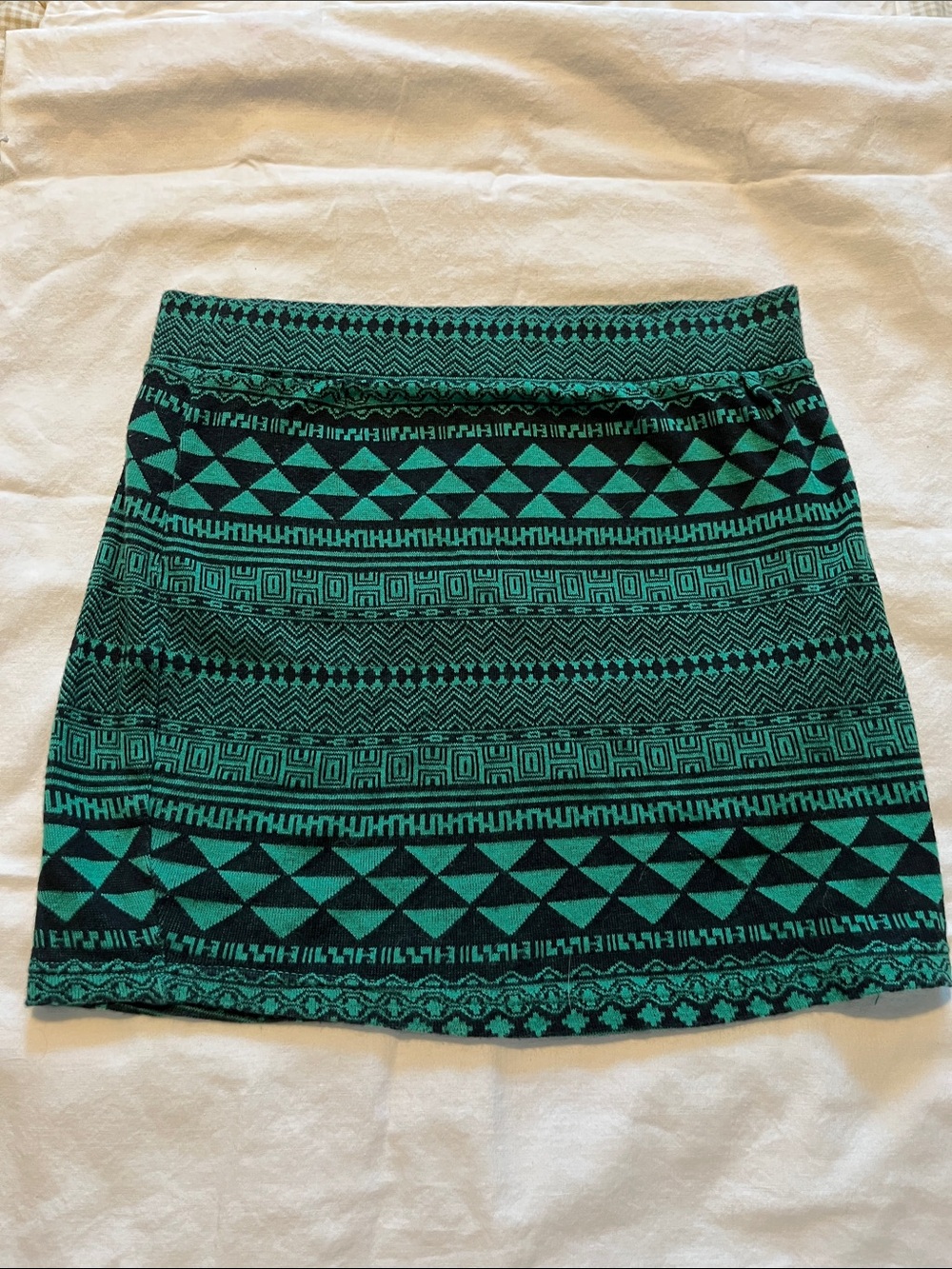 Sparkle & Fade Teal and Black Aztec pattern Knit Mini Skirt.   Size small.
